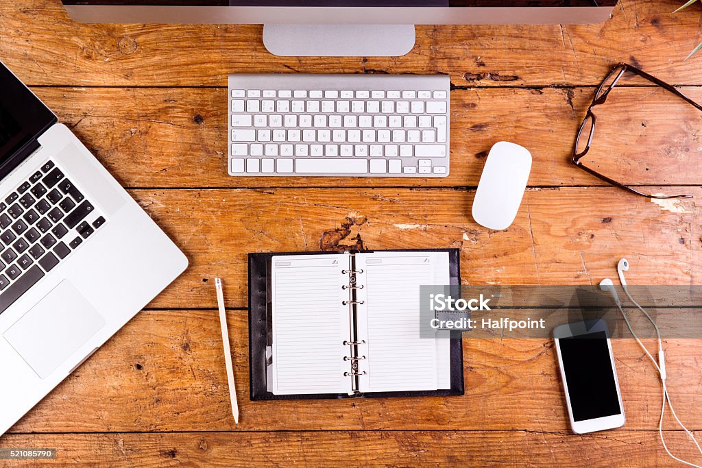 Desk Gadgets And Office Supplies Flat Lay Wooden Desk Stock Photo -  Download Image Now - iStock