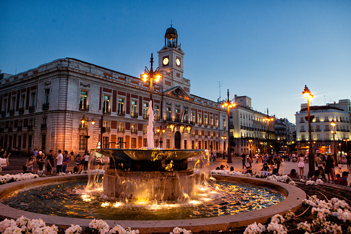 Madrid, Spain - June 30, 2014: Del Sol Square at Dusk with fountain in front