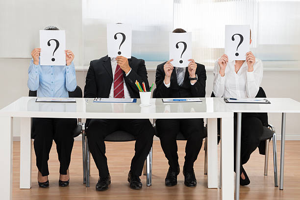 istock Businesspeople Hiding Face With Question Mark Sign 521086494