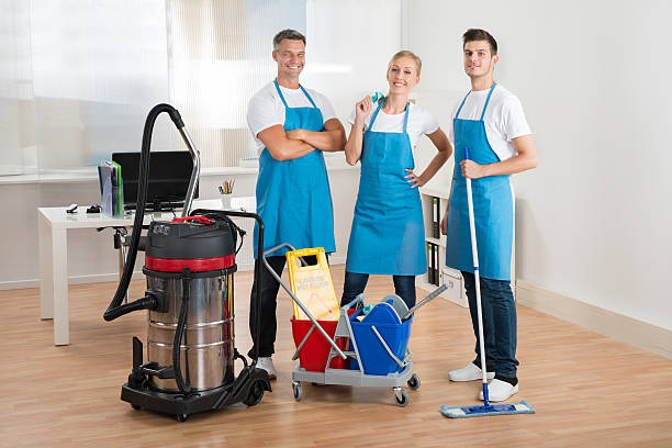 istock Janitors With Vacuum Cleaner And Cleaning Equipments 521086672