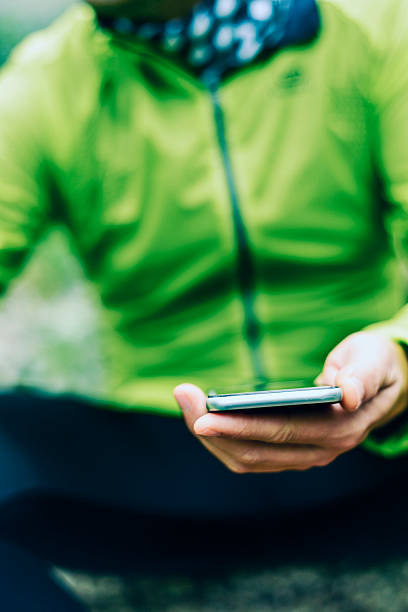 istock young sportsman using his smartphone 521087218