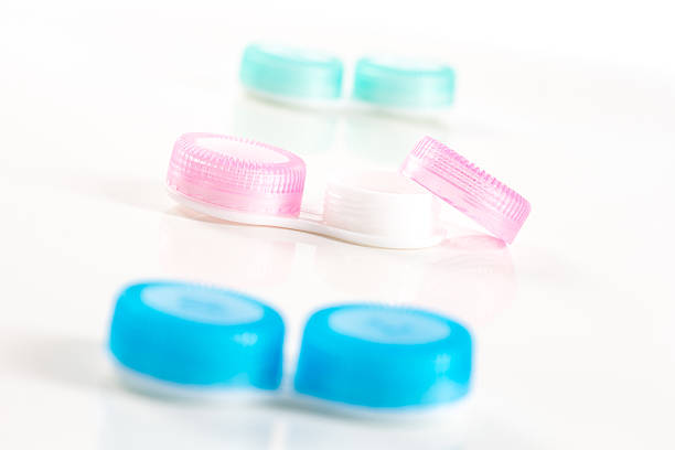 istock blue and pink plastic contacts case on the white background 521087226