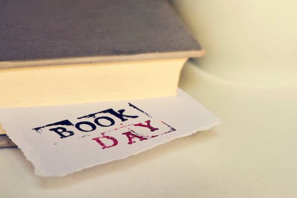 istock book and text book day in a piece of paper 521087300