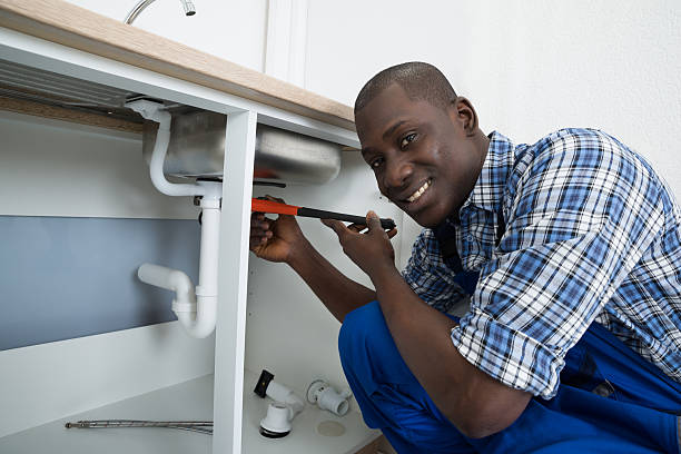 istock Male Plumber Fixing Pipe Of Sink 521087912