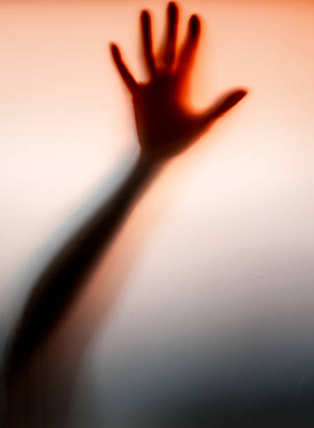 istock Red hand knocking on the glass 521089806