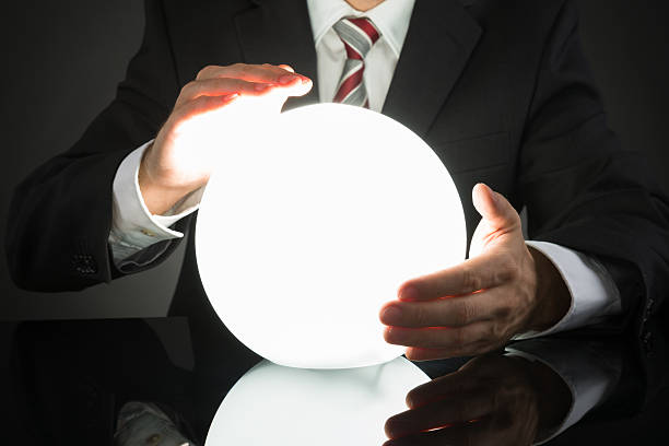 istock Businessman Predicting Future With Crystal Ball 521090440