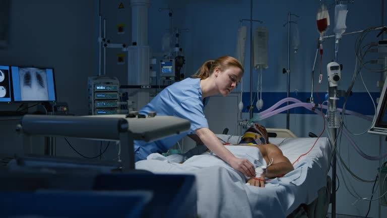 DS Nurse checking male patient in the intensive care