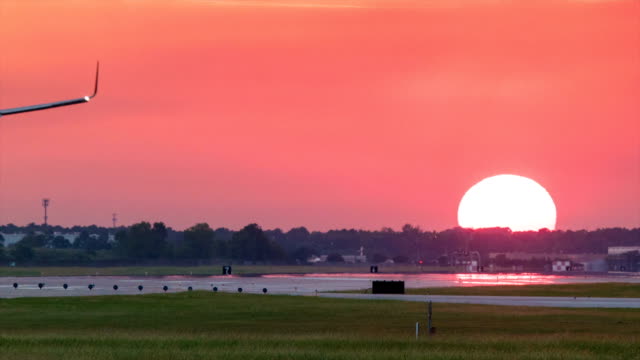 Airliner Landing at Vibrant Sunset in Houston Texas