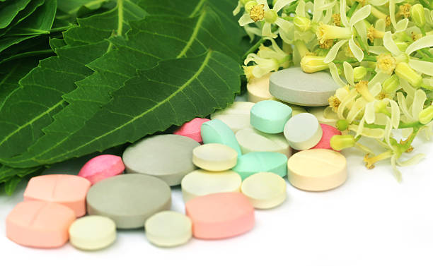 istock Pills made from medicinal neem flower and leaves 521107501