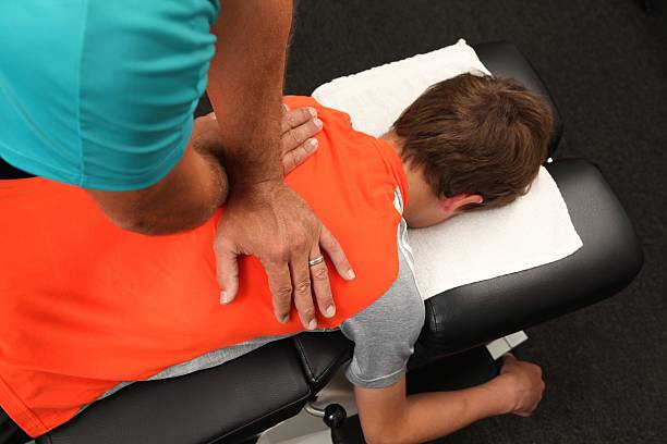 Chiropractor A Chiropractor adjusting a child chiropractic adjustment photos stock pictures, royalty-free photos & images