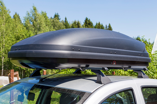 Car with the roof rack with cargo box