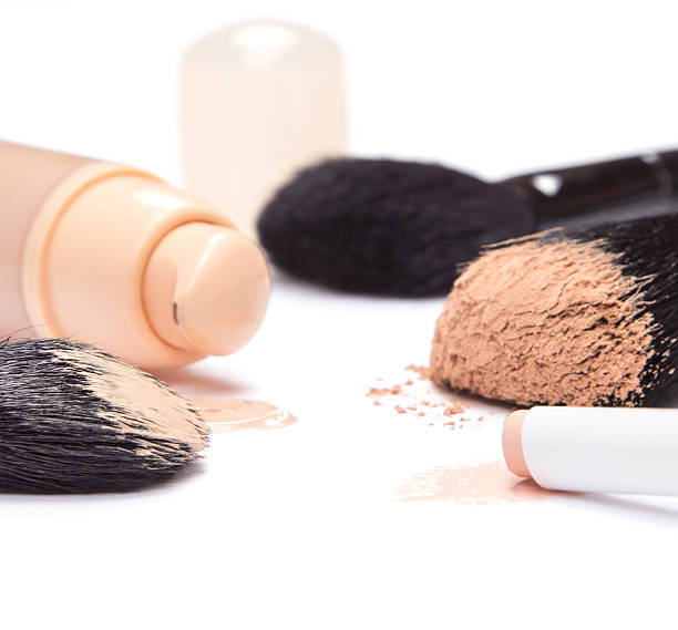 istock Foundation, concealer pencil and powder with makeup brushes 521110149
