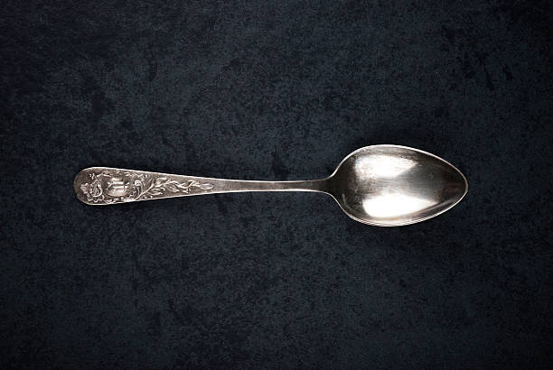 Spoon Silver spoon restaurant vintage, early 1930s with Elaborate Floral Design baby spoon stock pictures, royalty-free photos & images