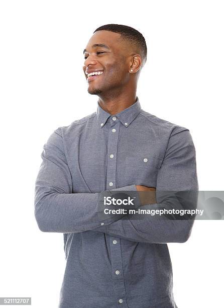 Fashionable Black Guy Smiling With Arms Crossed Stock Photo - Download Image Now - Men, Looking Away, White Background