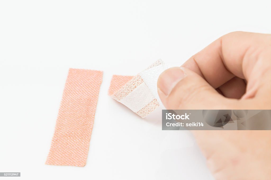 Using First Aid Kit Plaster Plaster First Aid Stock Photo - Download Image Now - Assistance, Bruise ...