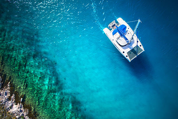 Amazing view to Catamaran in open sea at windy day stock photo