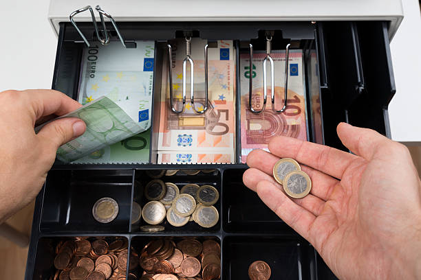 istock Person Hands With Money Over Cash Register 521123738