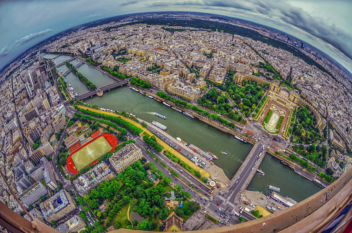 Paris, France- April 10, 2010: Paris is the center of French economy, politics and cultures and the top travel destinations in the globe.  It attracts the tourists all over the world.  Here is the aerial city view of Paris seen from Eiffel Tower.