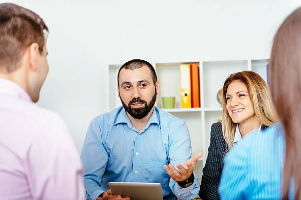 istock Brainstorming session with four young business people in office 521124124