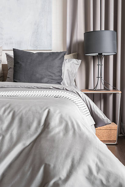 istock grey pillow on white bed in modern bedroom 521124676