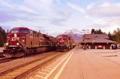 Banff, Canada, June 05, 2011: Freight trains from Vancouver and from Calgary meet each other in Banff at sunset time.