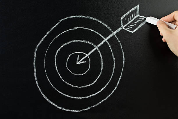 istock Person Drawing Dart And Arrow On Blackboard 521125690