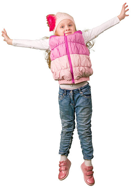 istock Cute little girl jumping 521127308