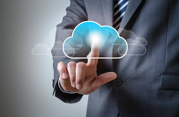 istock Business man touches a screen with a cloud symbol 521127820
