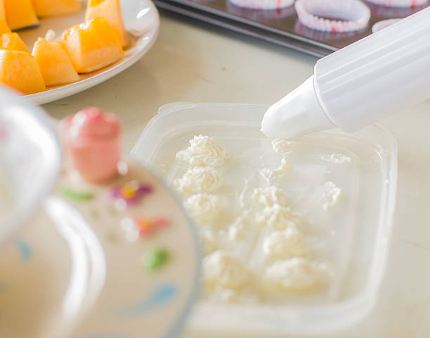 The action of decorating squeeze whipped cream.