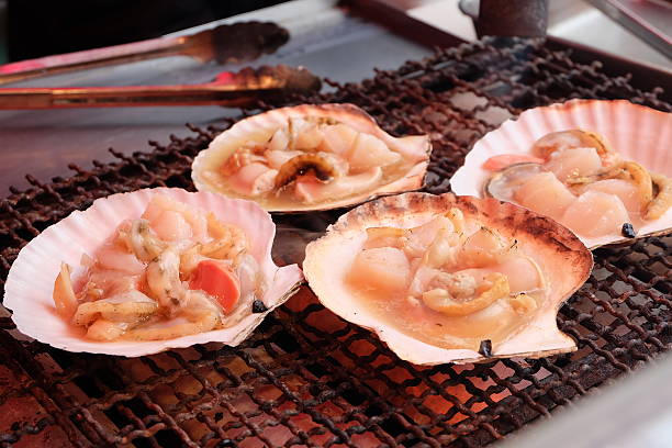 Grilled Japanese Scallops at Hakodate Morning Market hakodate stock pictures, royalty-free photos & images