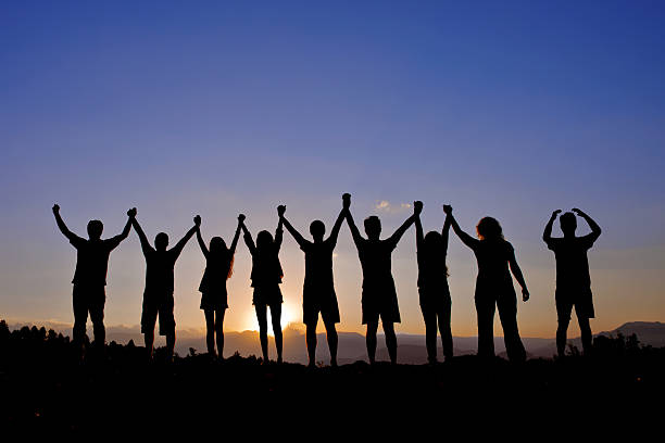 istock silhouettes of people on mountains 521132725