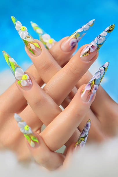 istock Acrylic flowers on women's nails. 521133017