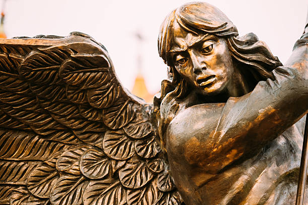 istock Statue Of Archangel Michael With Outstretched Wings Before Red C 521133057