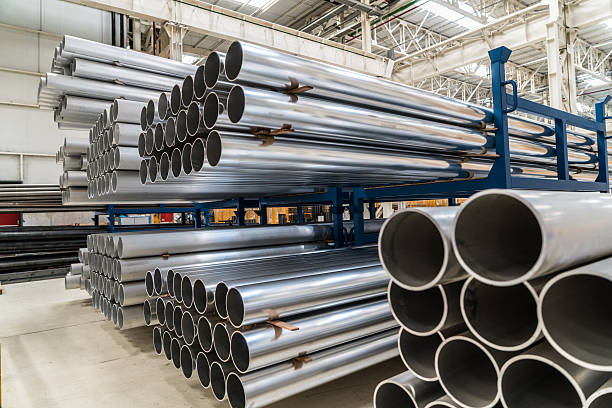 Aluminium Pipes Pile of alluminium pipes in the factory pipe tube stock pictures, royalty-free photos & images