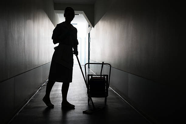 Silhouette Of Maid Cleaning Floor Silhouette Of Female Maid With Mop Cleaning Floor Of Hall custodian silhouette stock pictures, royalty-free photos & images