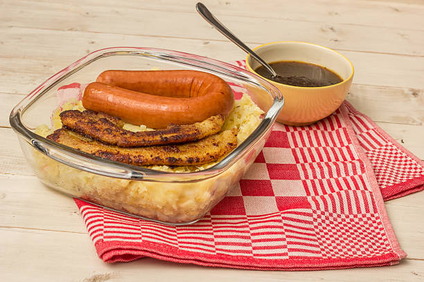 Typical dutch dish zuurkool with sauerkraut, pork belly, smoked sausage and gravy