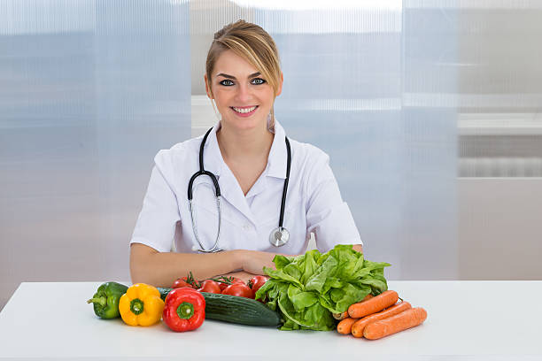 istock Female Dietician With Vegetables 521134856