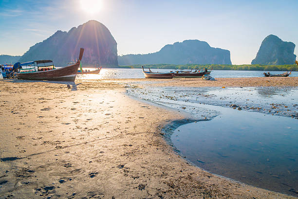 istock Beach and tropical sea with long-tail boat in thailand 521134926