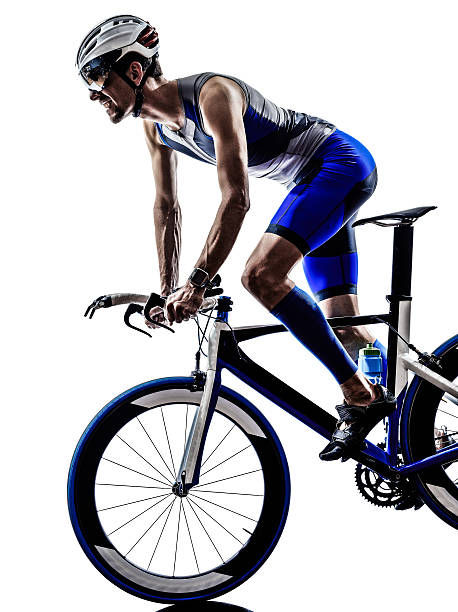 istock man triathlon iron man athlete cyclist bicycling 521134939