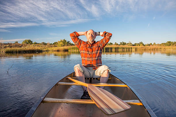 istock enjoying evening canoe paddling 521135061