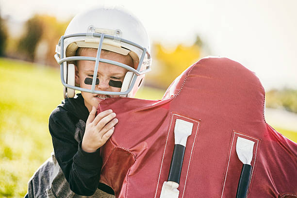 istock Young Football Player 521136029