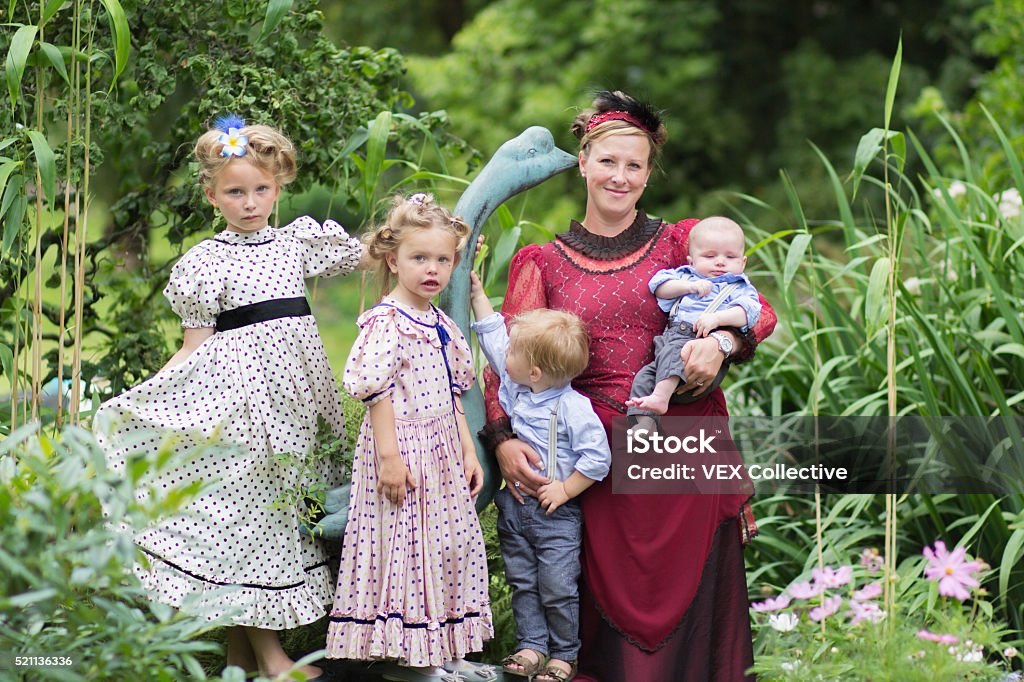 mother and daughters in edwardian dress A family dressed in edwardian outfit 2-3 Years Stock Photo