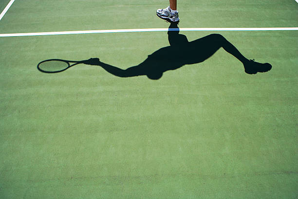 istock Shadow of person playing tennis 521136540