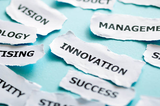 istock paper piece with success business concept word innovation 521136541