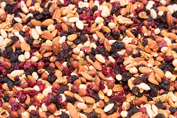 istock Mixed nuts with raisins and dried cranberries 521136937