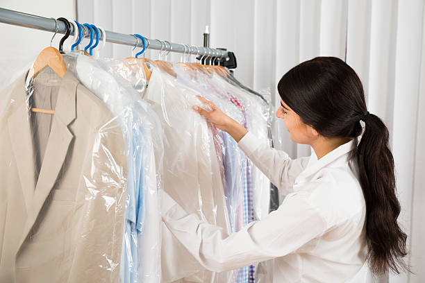 istock Woman Looking At Clothes In Shop 521137174
