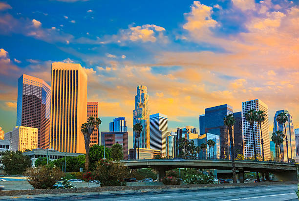 istock Skyscrapers of Los Angeles skyline with sunset clouds, CA 521138031