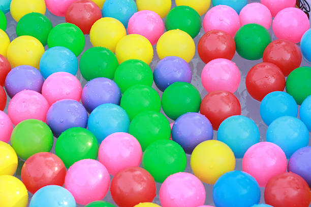 Ball toy for dog on a white wooden table wall background