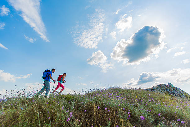 istock Young couple hiking on the mountain 521138783