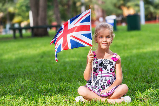istock Little girl with a british flag 521139077
